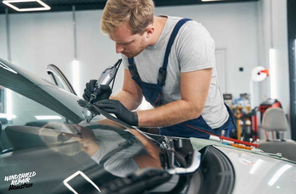 Close-up of windshield adhesive installation process